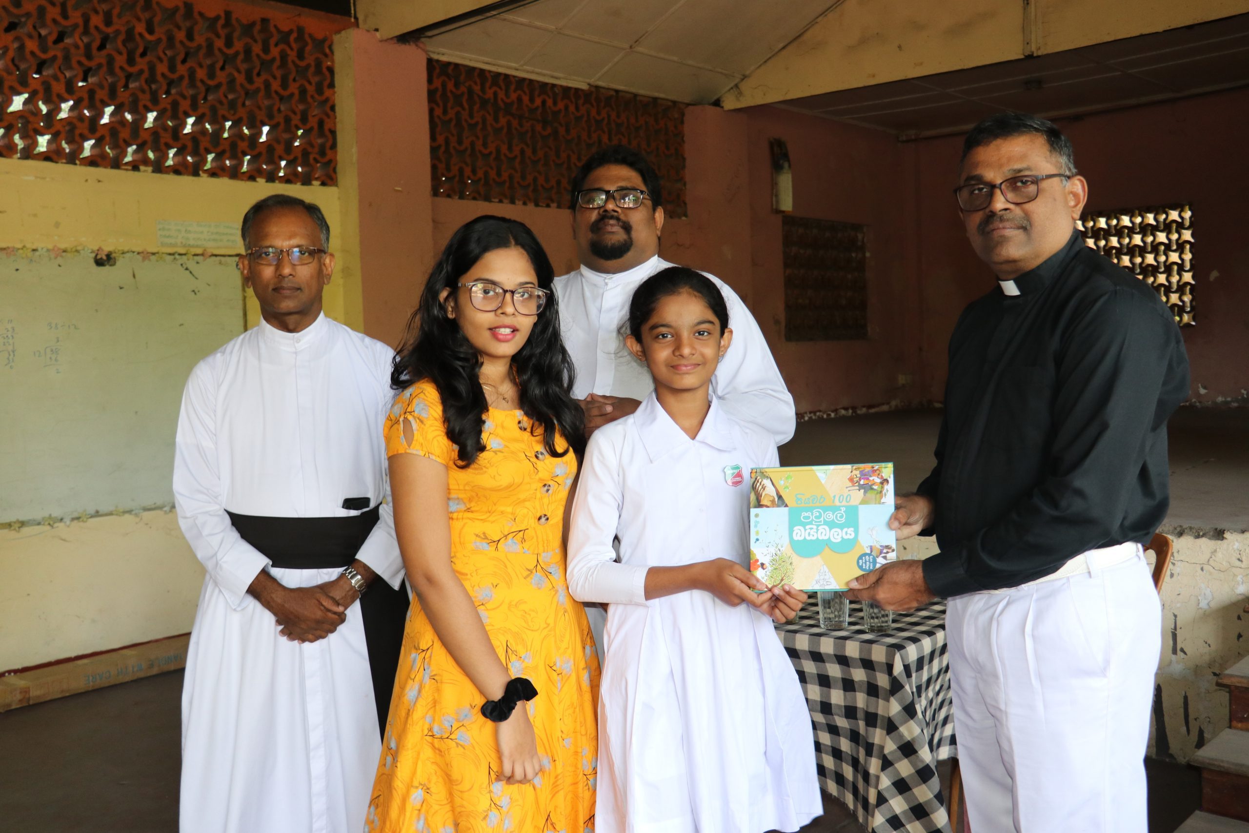 family receiving a 100 steps family bible